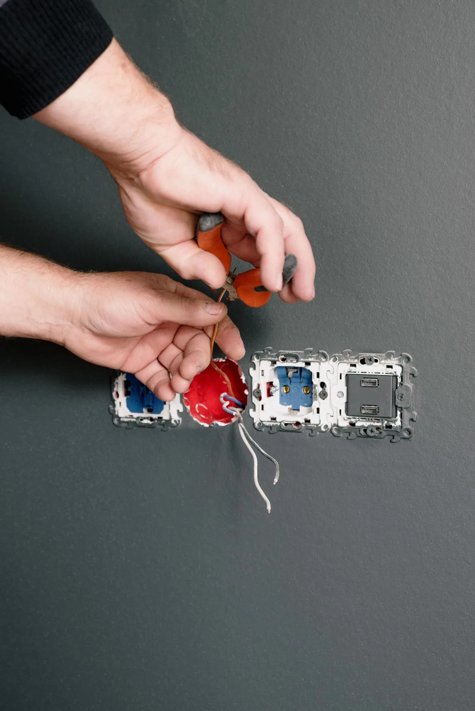 Electrician installing ev charger — Electricians marketing by TML Agency