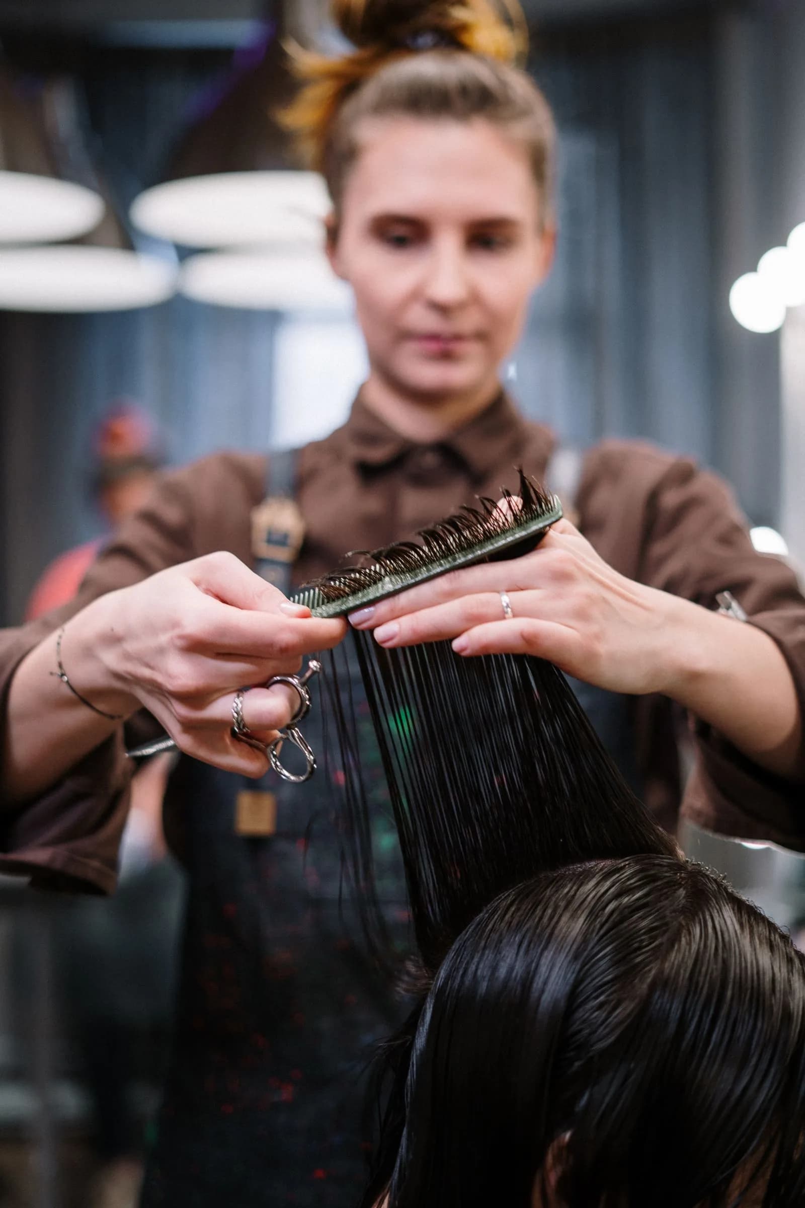 Hairdresser cutting hair — Hair Salons marketing by TML Agency