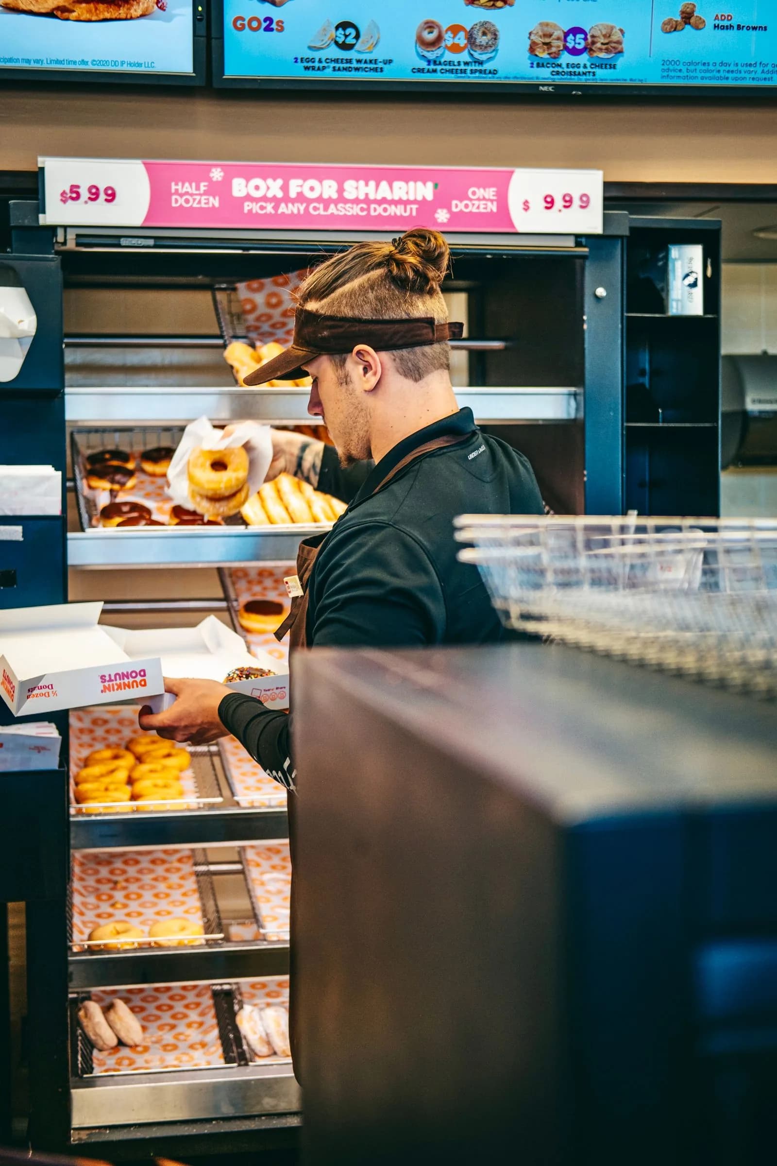 Franchise worker serving customer — Franchise Systems marketing by TML Agency