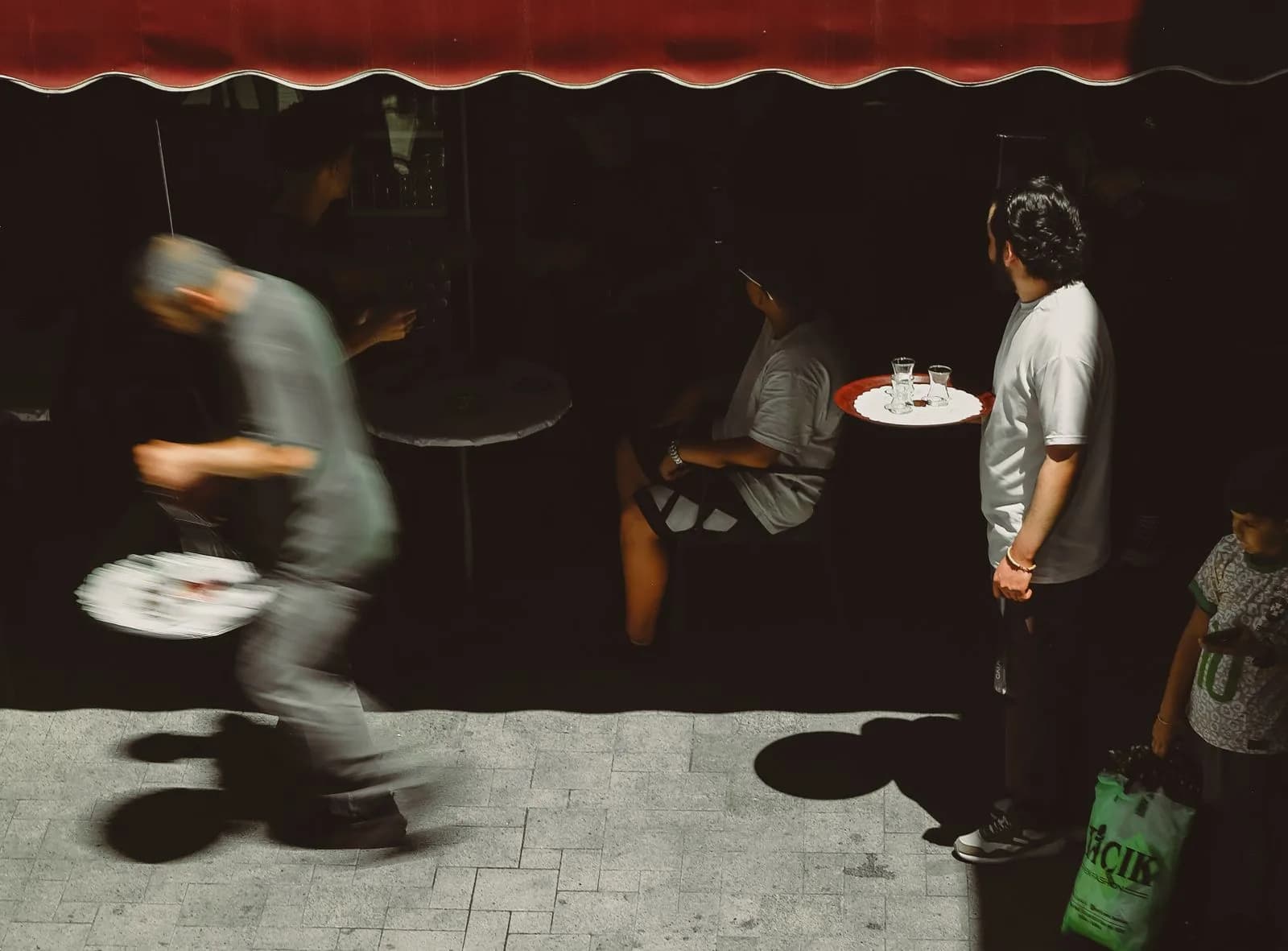 Waiter serving customers — Hospitality & Restaurants marketing by TML Agency
