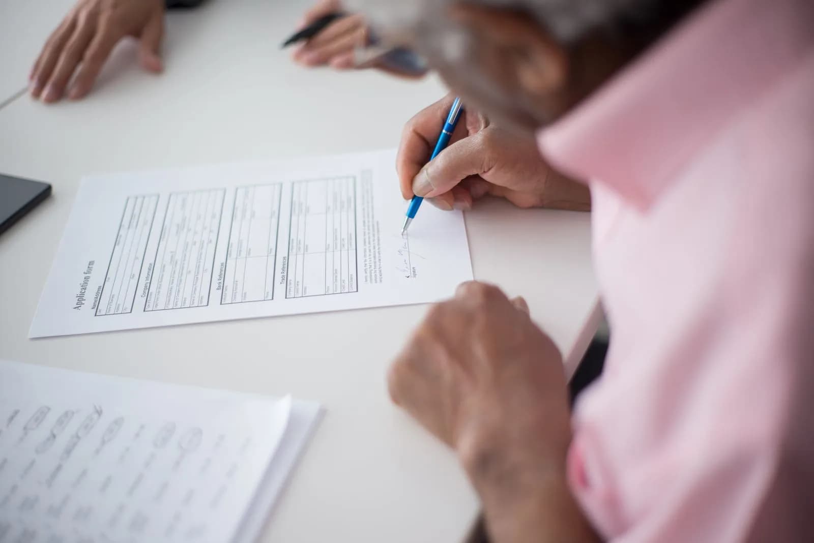 Consultant completing application — Immigration Consultants marketing by TML Agency