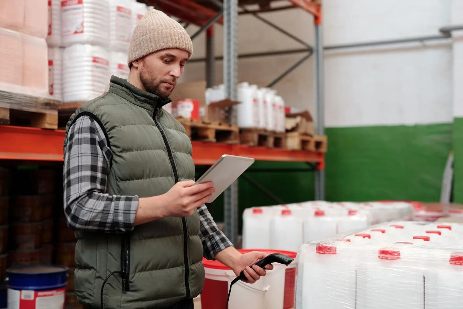 Warehouse worker scanning packages — Logistics & Transportation marketing by TML Agency