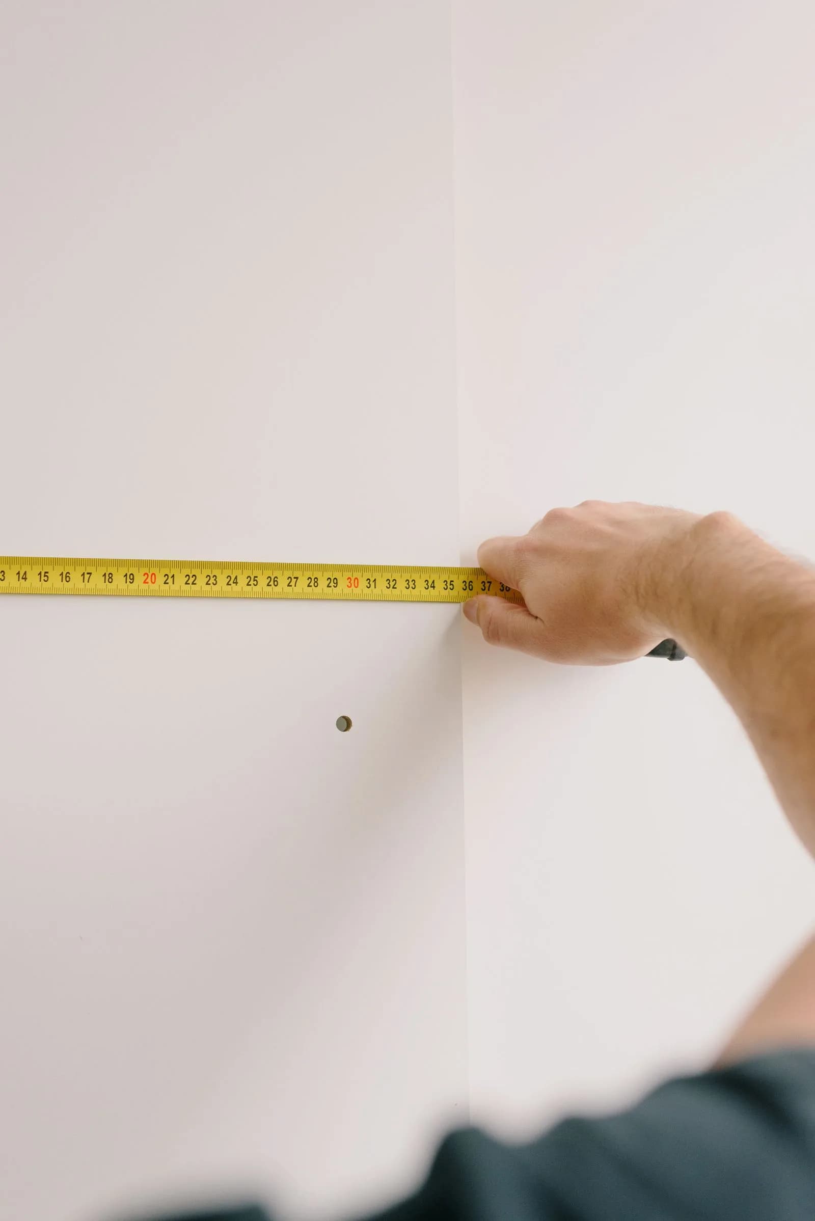 Designer measuring room — Interior Designers & Design Studios marketing by TML Agency